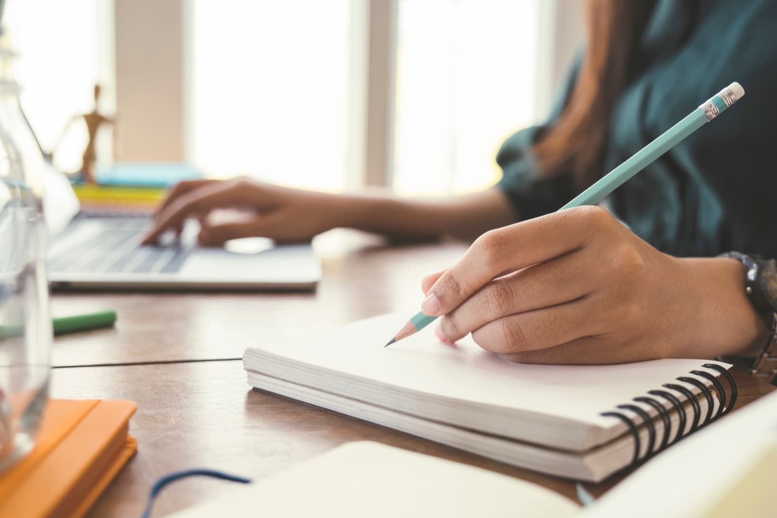 Student writing in a notebook